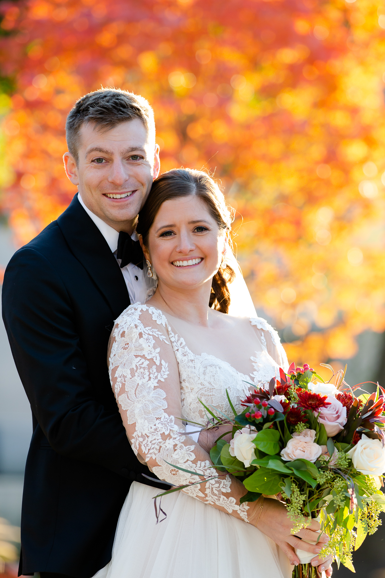 Classic groom portrait adjusting bowtie