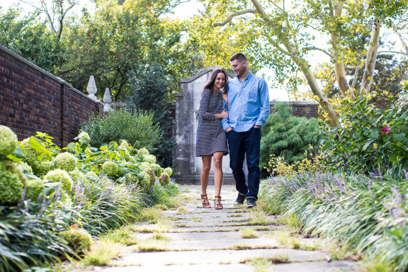 Couple walking next to Mellon park walled garden