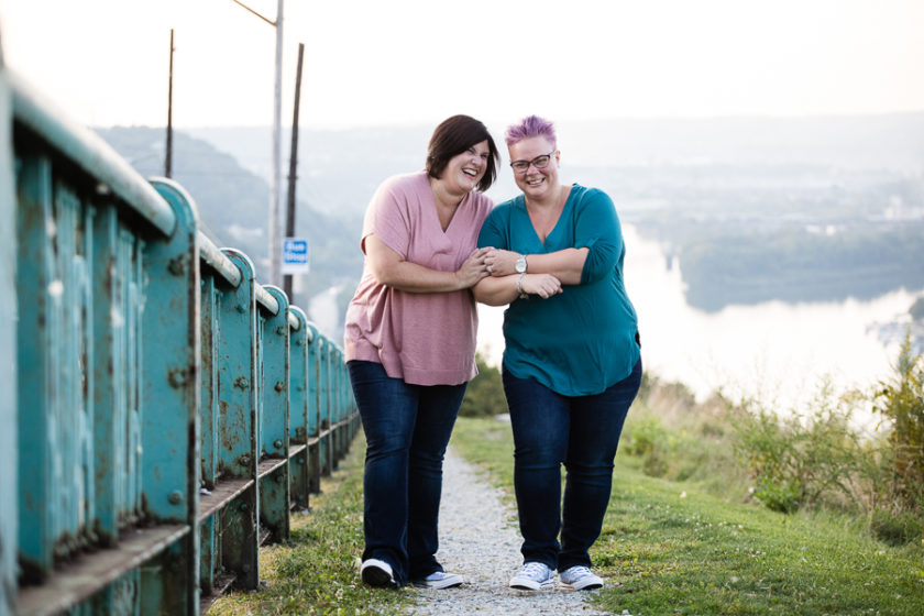 Two women walking and laughing along Mount Washington