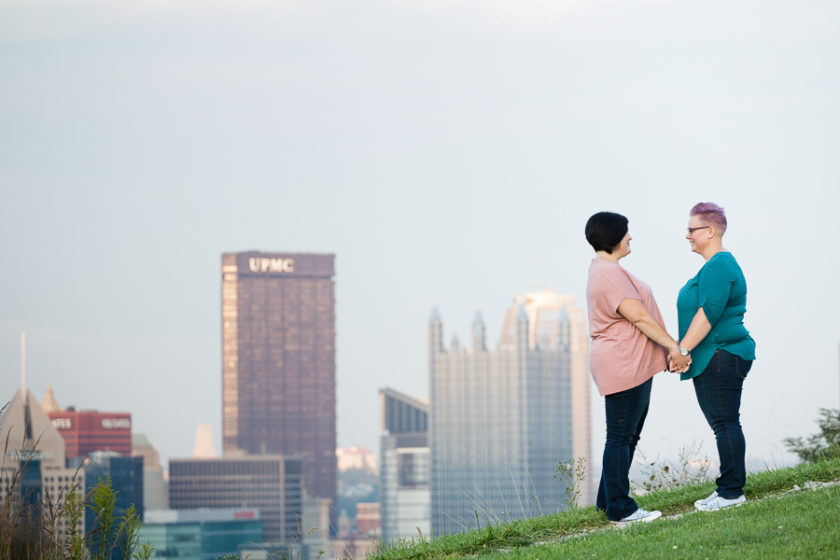 Engaged Women Holding Hands with Pittsburgh in the Distance