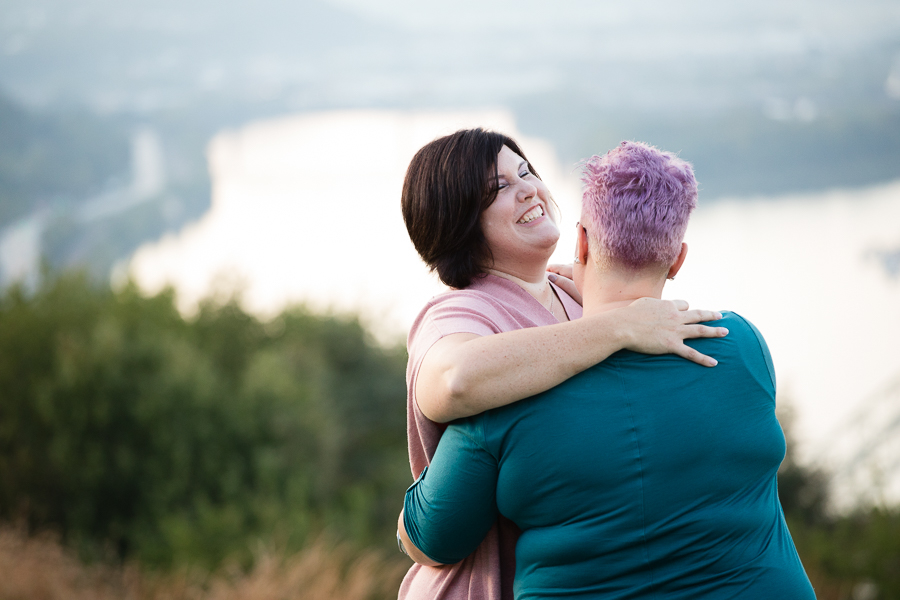 Women in Love Embracing and Laughing