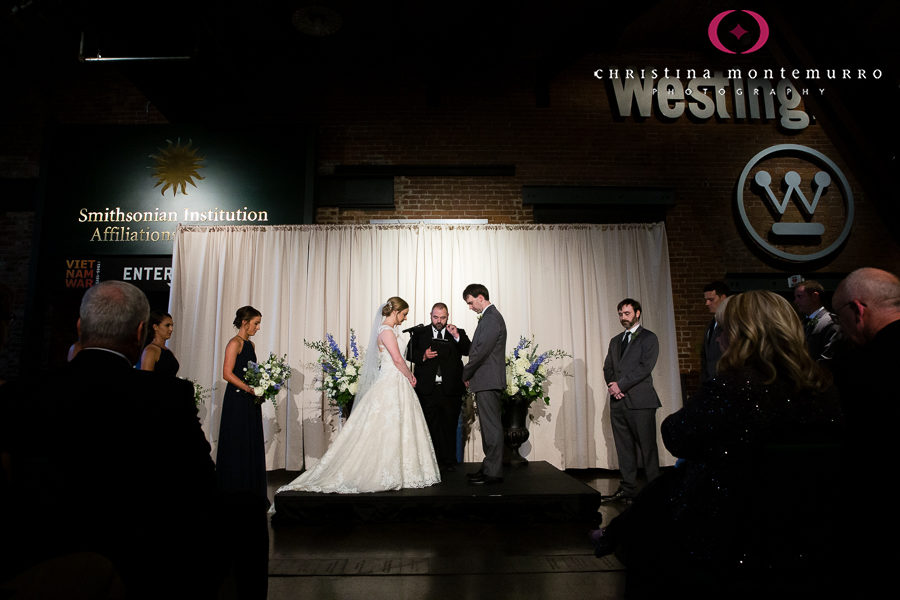 Bride and Groom at Wedding Ceremony in Great Hall with Cream Linen Backdrop Drape