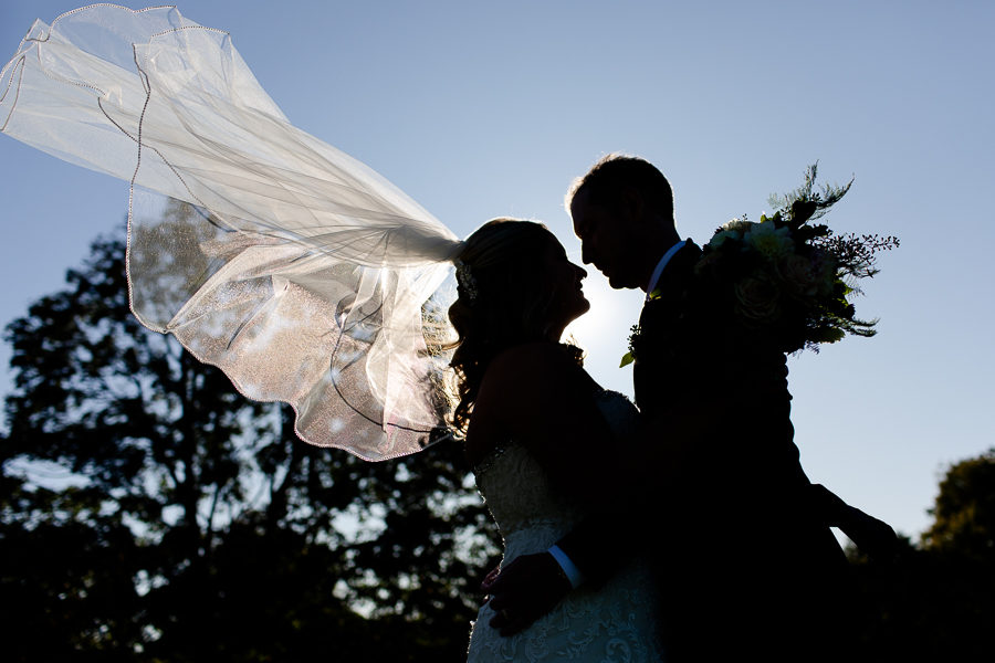 Bride and Groom Silhouette with Veil Flying