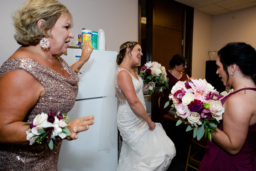 Bride and mom and bridesmaids singing before the wedding ceremony