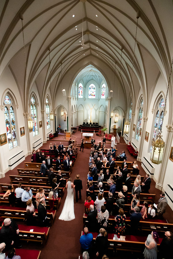 Bride walking down the aisle at Duquesne University Chapel