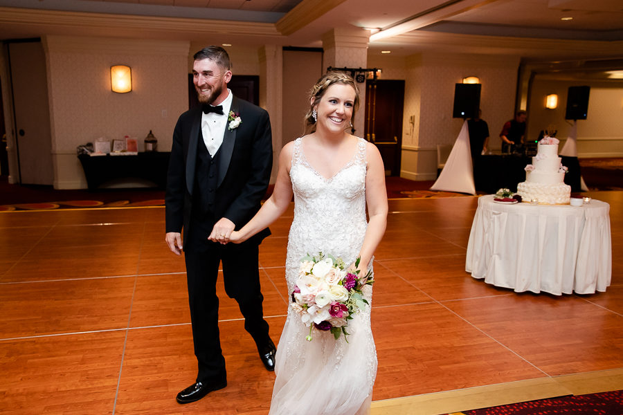 Bride and groom enter reception