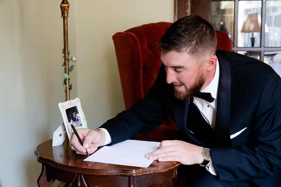 Groom writing card