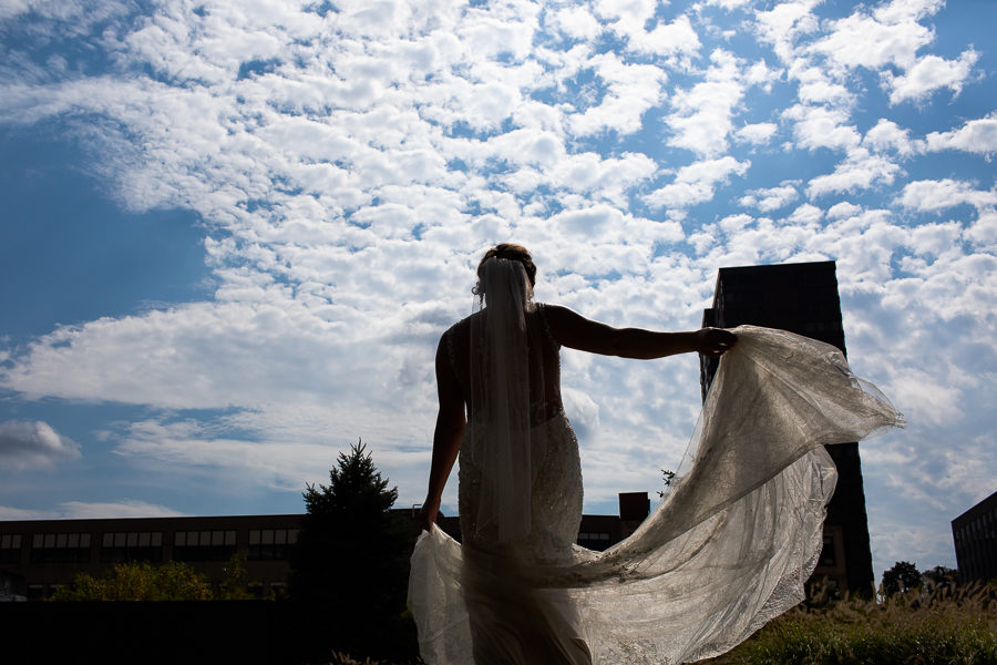 Bride twirling Justin Alexander Gown