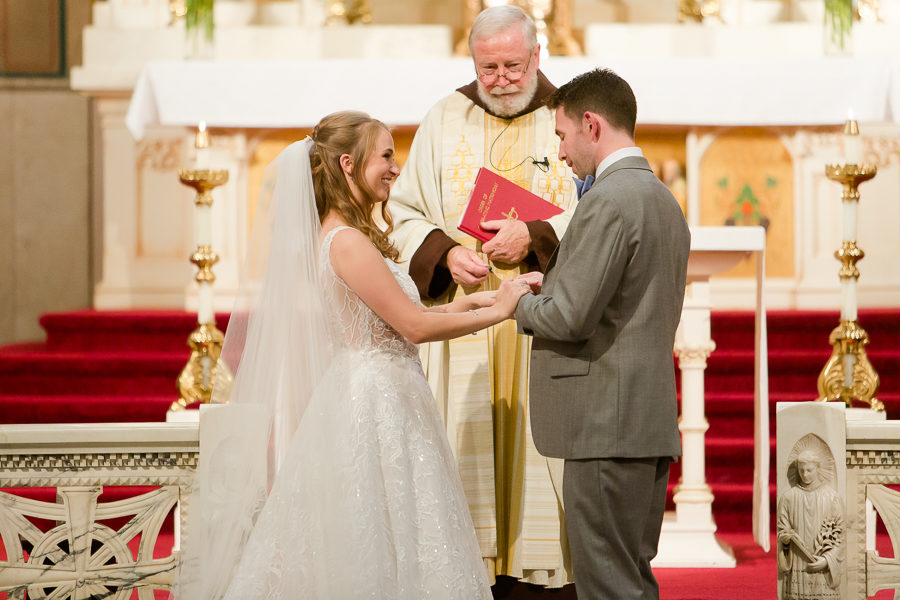 Lauren and Matt exchange rings at St. Augustine Church Pittsburgh