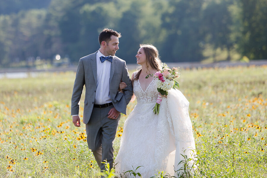 Bride and groom in field of black-eyed-Susans at North Park